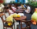 Instead of guests, plush figures sit at tables in the cafe durin