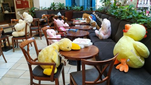 Instead of guests, plush figures sit at tables in the cafe durin Instead of guests, plush figures sit at tables in the cafe durin