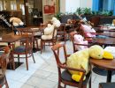 Instead of guests, plush figures sit at tables in the cafe durin
