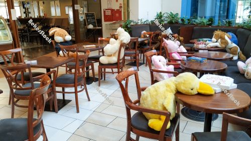 Instead of guests, plush figures sit at tables in the cafe durin Instead of guests, plush figures sit at tables in the cafe durin