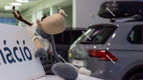 Christmas reindeer figurine in the car showroom Christmas reindeer figurine in the car showroom