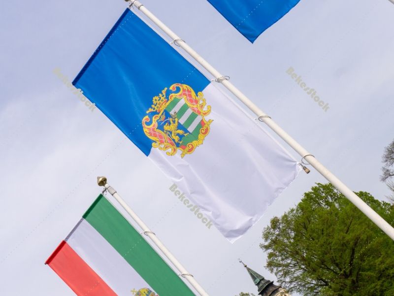 The flag of Hungary, the flag of Békés county and the flag of  The flag of Hungary, the flag of Békés county and the flag of