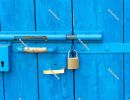 Old style lock and padlock on the blue wooden door - Portoroz, P