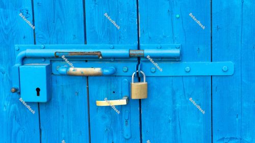 Old style lock and padlock on the blue wooden door - Portoroz, P Old style lock and padlock on the blue wooden door - Portoroz, P