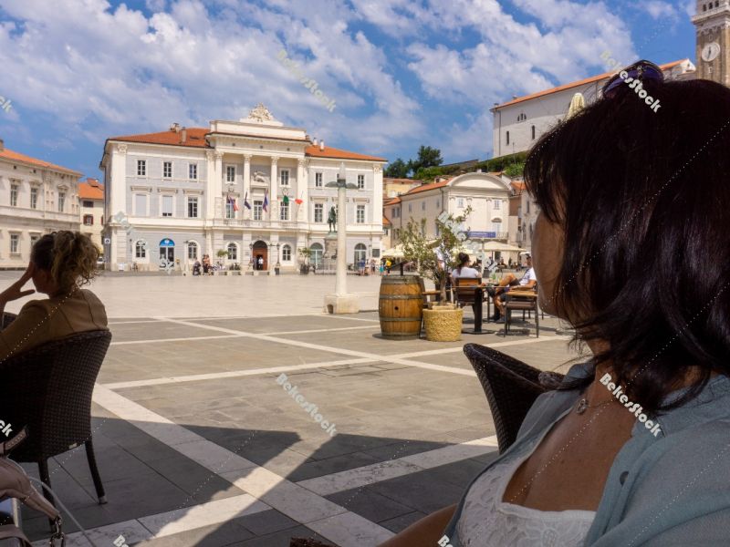 Guests are sitting on the terrace of the cafe, Piran, Obalno-kra Guests are sitting on the terrace of the cafe, Piran, Obalno-kra