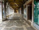 Deserted arcade on St. Mark's Square in Venice during the corona