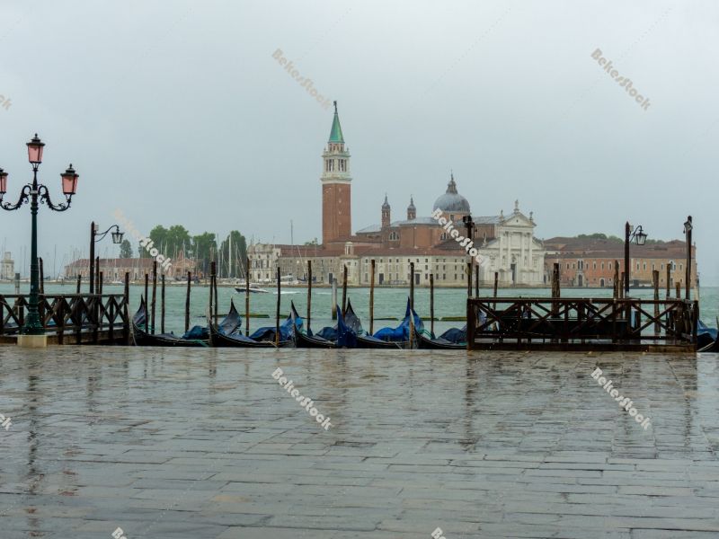 Empty gondolas moored, without tourists in Venice during the cor Empty gondolas moored, without tourists in Venice during the cor