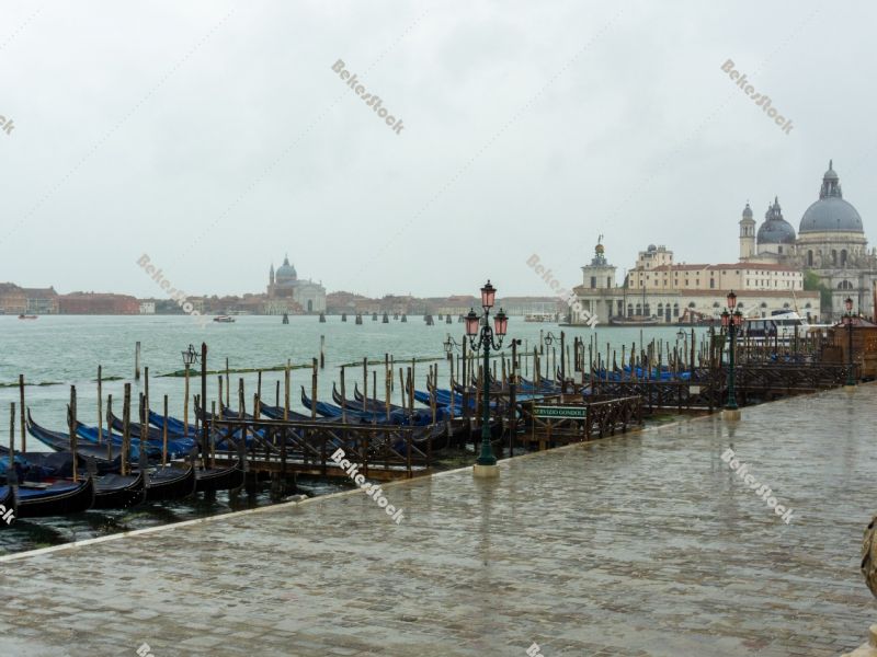 Empty gondolas moored, without tourists in Venice during the cor Empty gondolas moored, without tourists in Venice during the cor
