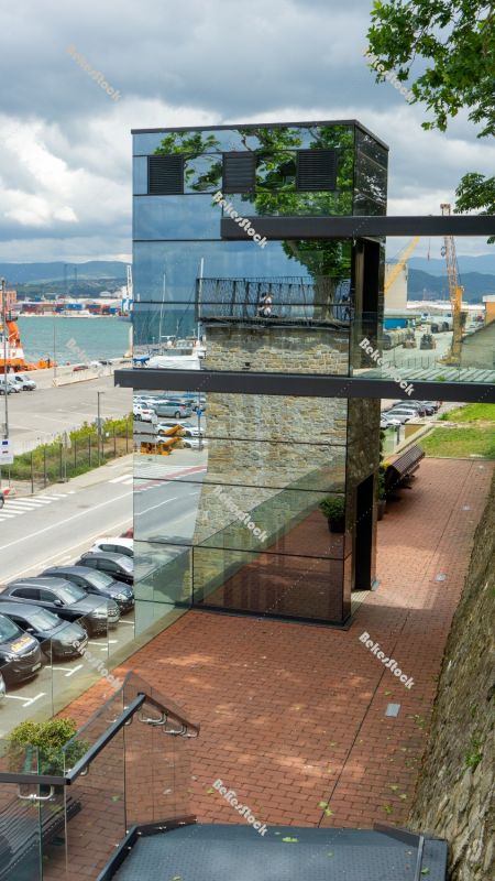 Panoramic glass elevator in the port of Koper. Koper (`Capodistr Panoramic glass elevator in the port of Koper. Koper (`Capodistr