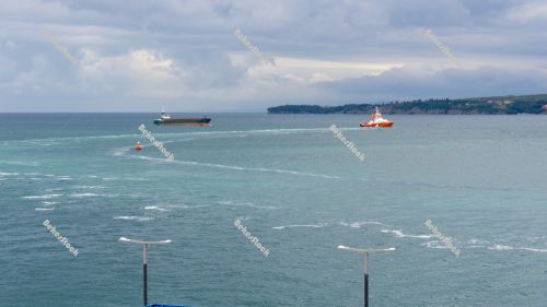 A pilot boat leads a container vessel to port. Luka Koper (`Capo A pilot boat leads a container vessel to port. Luka Koper (`Capo