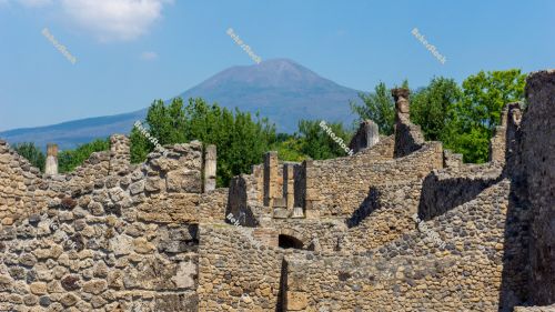 Ancient ruins of Pompeii, with Mount Vesuvius (`Vesuvio`) in the Ancient ruins of Pompeii, with Mount Vesuvius (`Vesuvio`) in the