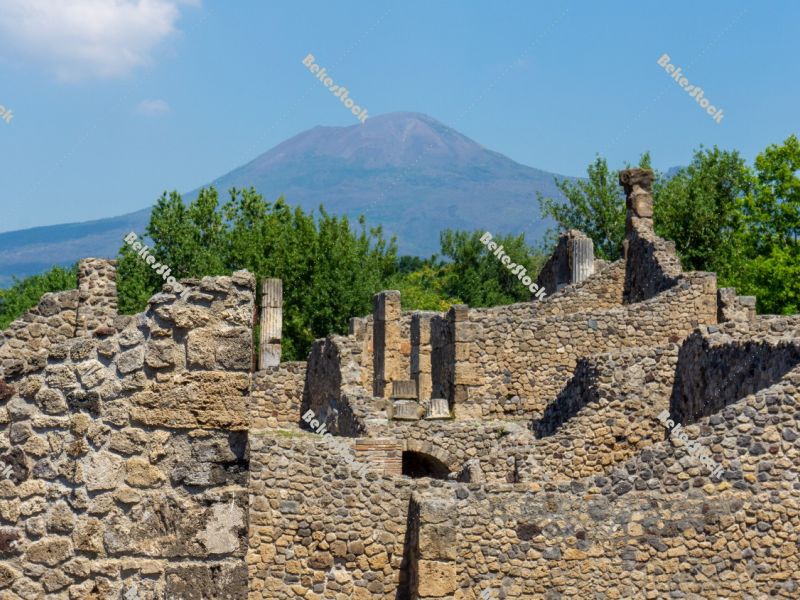 Ancient ruins of Pompeii, with Mount Vesuvius (`Vesuvio`) in the Ancient ruins of Pompeii, with Mount Vesuvius (`Vesuvio`) in the