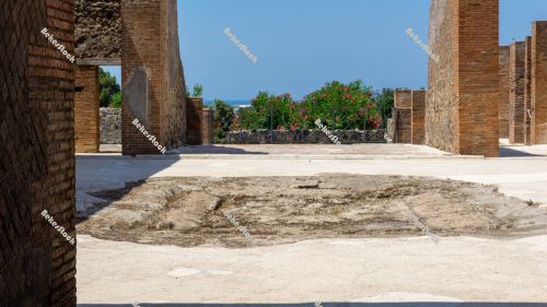 Courtyard of a building in Pompeii, with Lenader and the blue sk Courtyard of a building in Pompeii, with Lenader and the blue sk