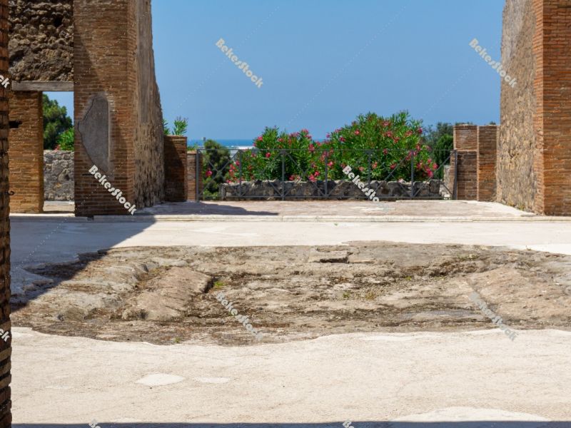 Courtyard of a building in Pompeii, with Lenader and the blue sk Courtyard of a building in Pompeii, with Lenader and the blue sk